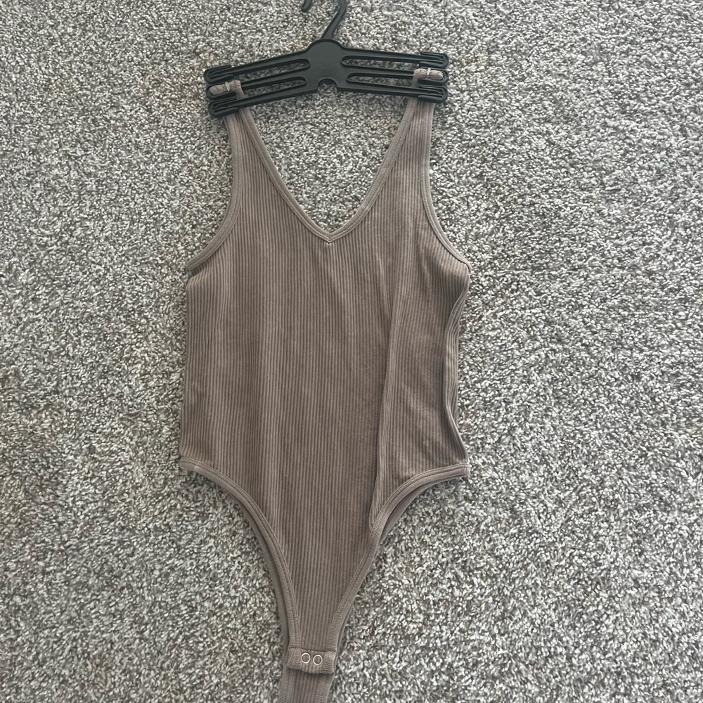 Pink Rose Tan Jumpsuit with V-Neckline and Sleeveless Design